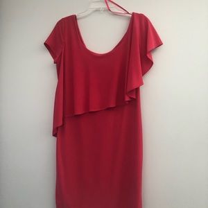 Short pink or watermelon colored dress. Cap sleeves with flowey detail. Size 8.